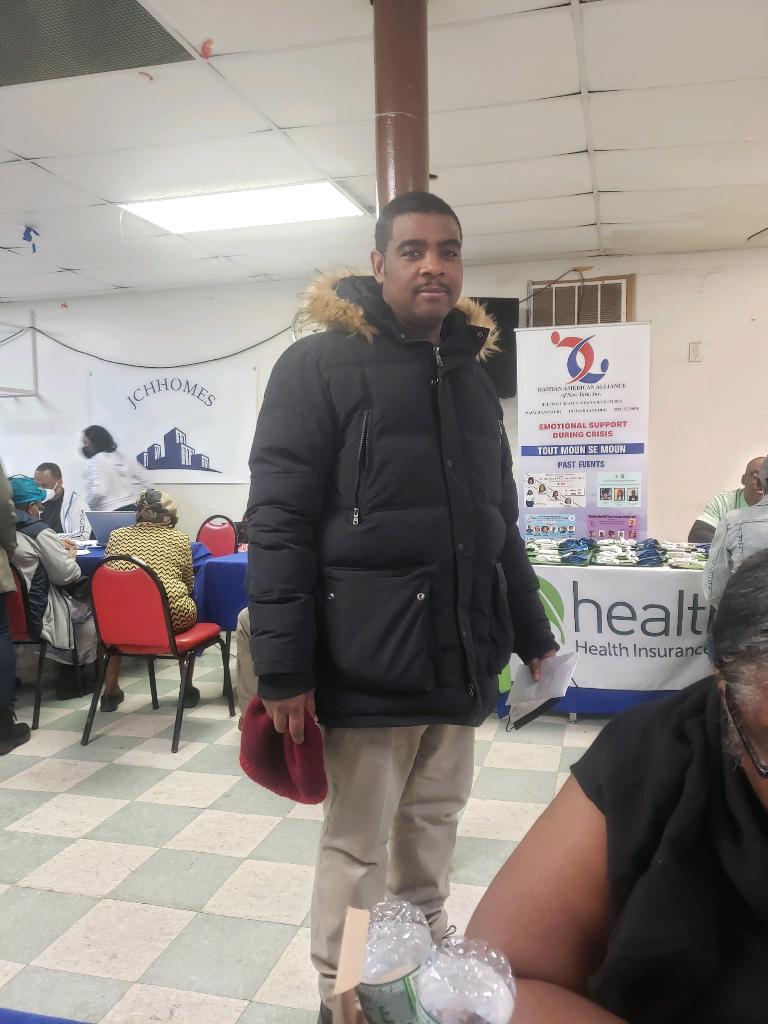 A man in the event of JCHHOMES Collaboration with Haitian American Alliance
